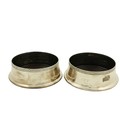 A pair of modern Irish silver Wine Coasters, Dublin c. 1999, each with a Celtic design rim and woode... 