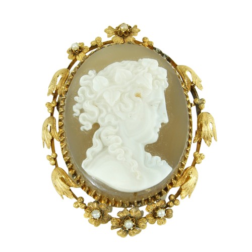 236 - An attractive large carved Cameo Brooch, of a classical lady in gold, oval mount, decorated with lea... 