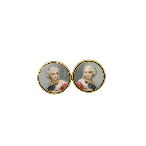 246 - An unusual pair of small circular gold Studs, each inset with fine miniatures, heads and shoulders o... 