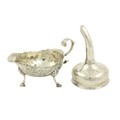 A George III small silver helmet shaped Gravy Boat, London c. 1799, chased with floral and leaf scro... 