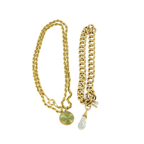 252 - A small gold Necklace, with clover pendant; and a gold link Bracelet with small crystal charm. (2)... 