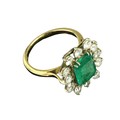 An attractive Edwardian Ladies 18ct gold Cluster Ring, with large central square emerald, surrounded... 