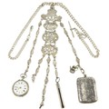 A very good late 19th Century / early 20th Century decorated pierced and engraved silver Chatelaine,... 