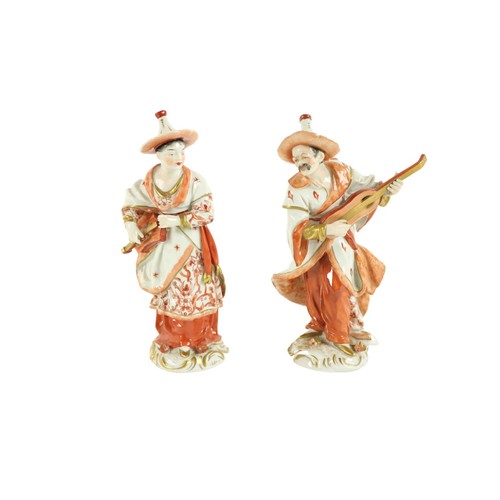 372 - A pair of Sitzendorf porcelain Figures, modelled as an Asian male and female musician, 20cms (8