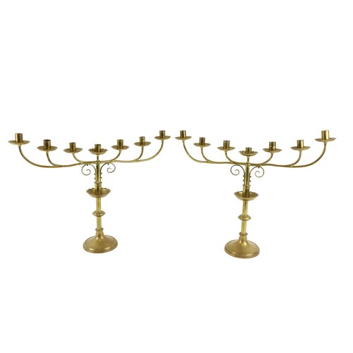 381 - A pair of brass six branch - seven light Altar Candelabra, 17 1/2