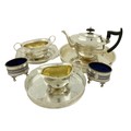 A three piece silver plated Tea Service, 20th Century; together with a pierced and silver plated Tra... 