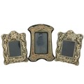 A pair of modern silver Photograph Frames, each with classical cherubs in relief, 20cms x 14cms (8