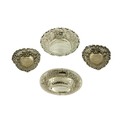 A pair of embossed and pierced silver pear shaped Bon Bon Dishes; another oval ditto; and one pierce... 