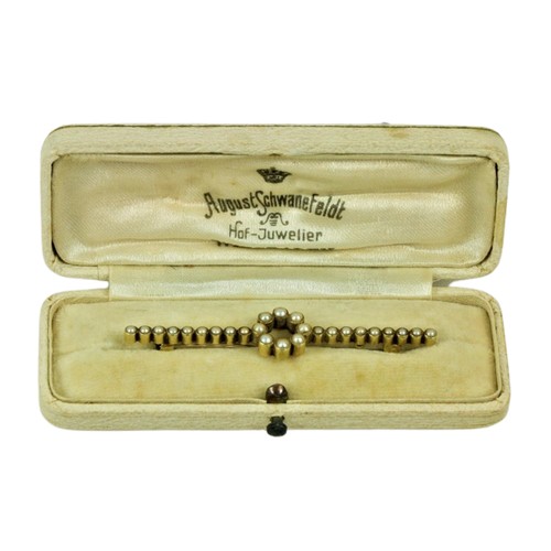 231 - A 15ct gold and seed pearl Bar Brooch, with circular centre. (1)