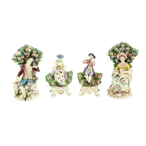 365 - A pair of Chelsea style porcelain Groups, one modelled as Gentleman with sheep, the other a Lady wit... 