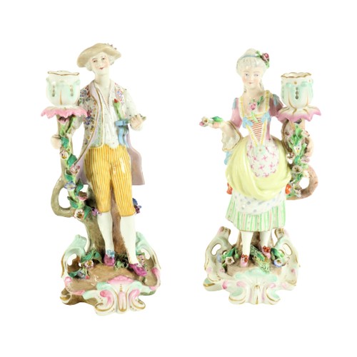 370 - A pair of attractive German porcelain Candlestick Groups, early 20th Century, one modelled as an ele... 