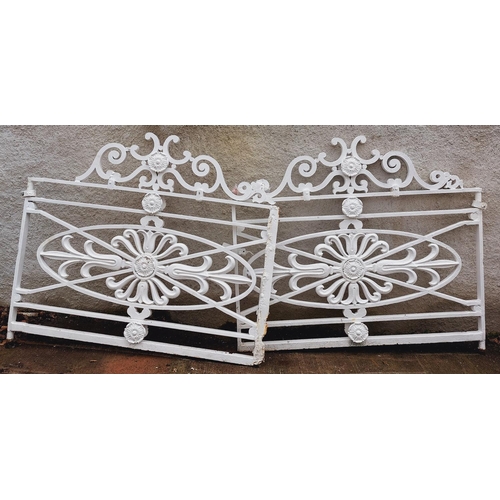 1009 - A  pair of important early 19th Century heavy Gates, each with S scrolled designs and floral motif c... 