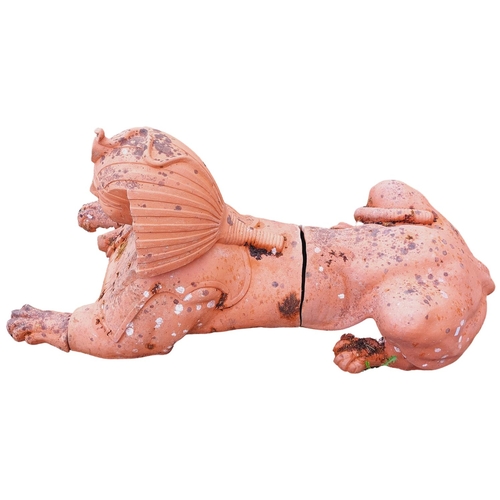 1018 - A large terracotta Model of an Egyptian Pharaoh, modelled as a recumbent lion (some damage), 150cms ... 