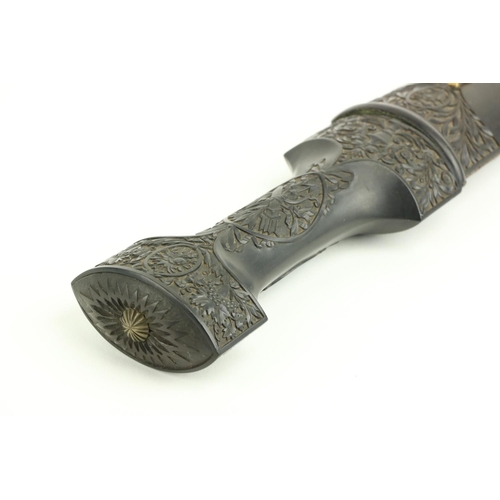 610 - A fine quality 19th Century Middle Eastern Ceremonial Dagger, the plain steel blade housed in a carv... 