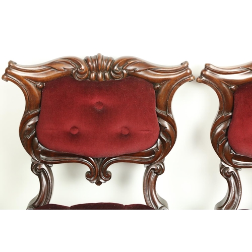 619 - A set of 4 Victorian mahogany Side Chairs, each with a cartouche shaped back with upholstered centre... 