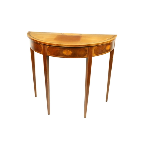 621 - An inlaid demi-lune mahogany Side Table, in the George III style with central fan inlay, inside... 