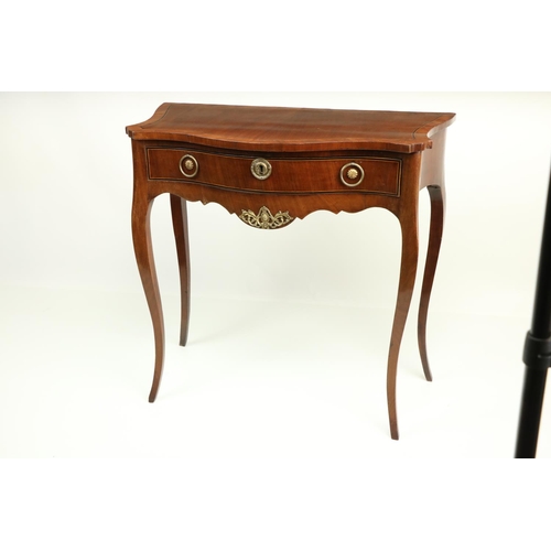 629 - An unusual serpentine fronted walnut Side Table, in the 18th Century style, with rosewood banded top... 