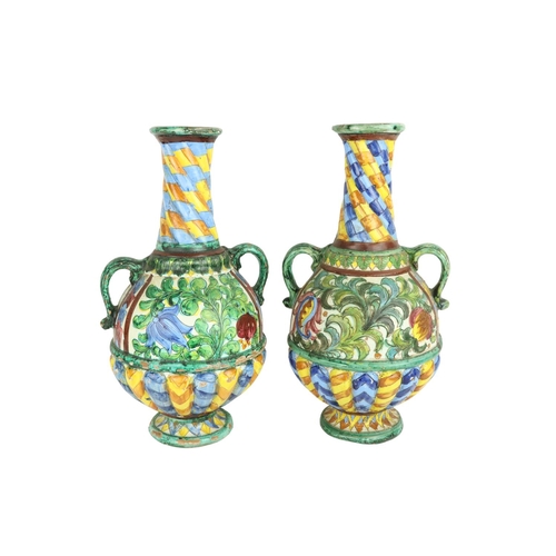 630 - A pair of colourful Italian Majolica two handled Vases, each with half reeded body, 44cms (17