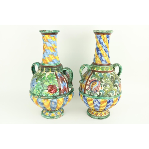 630 - A pair of colourful Italian Majolica two handled Vases, each with half reeded body, 44cms (17