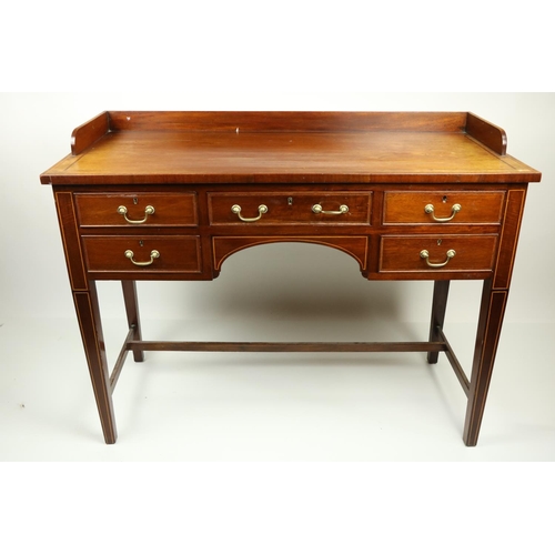 631 - An Edwardian mahogany and kingwood banded Dressing Table, with three quarter gallery above a kneehol... 