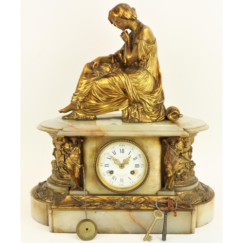 638 - After J. PradierA French onyx and brass Mantle Clock, surmounted with a seated classical woman, abov... 