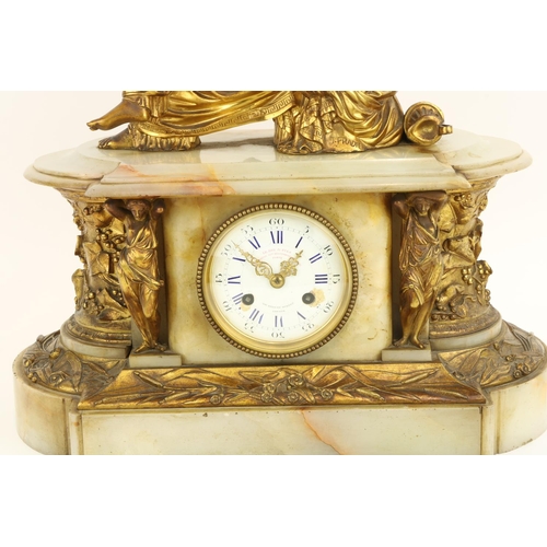 638 - After J. PradierA French onyx and brass Mantle Clock, surmounted with a seated classical woman, abov... 