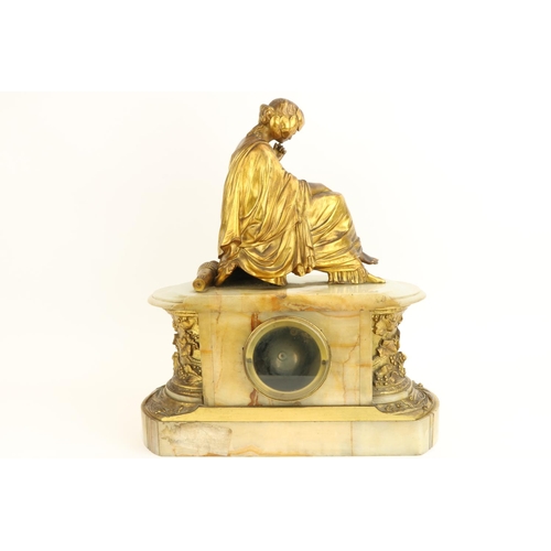 638 - After J. PradierA French onyx and brass Mantle Clock, surmounted with a seated classical woman, abov... 