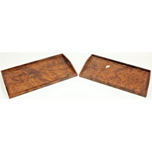 660 - An attractive pair of elongated burr maple Serving Trays, with pierced handles and arched sides, app... 