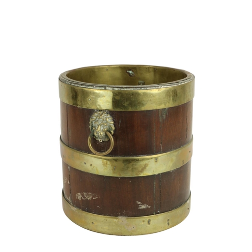 664 - A 19th Century Irish mahogany brass bound Bucket, with built-in brass interior, lion mask drop handl... 