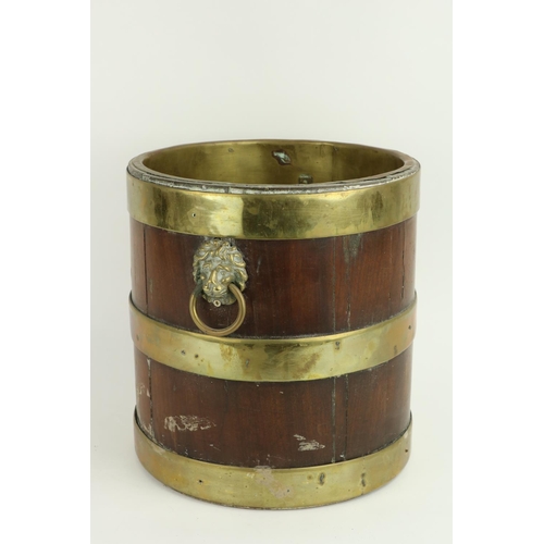 664 - A 19th Century Irish mahogany brass bound Bucket, with built-in brass interior, lion mask drop handl... 