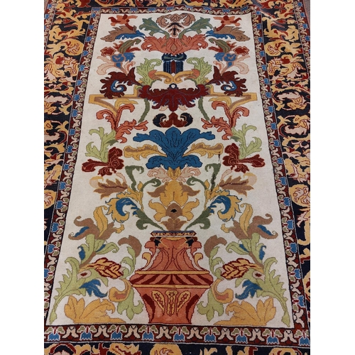 702 - A fine quality 19th Century Middle Eastern silk Rug, the rectangular cream ground centre with multip... 