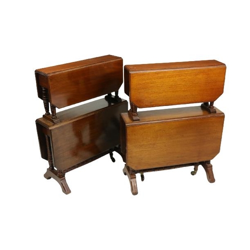 711 - An unusual pair of Edwardian walnut two tier Sutherland Tables, each tier with two rectangular flaps... 