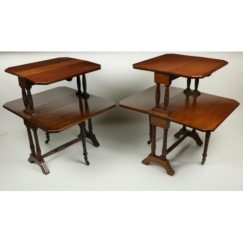 711 - An unusual pair of Edwardian walnut two tier Sutherland Tables, each tier with two rectangular flaps... 