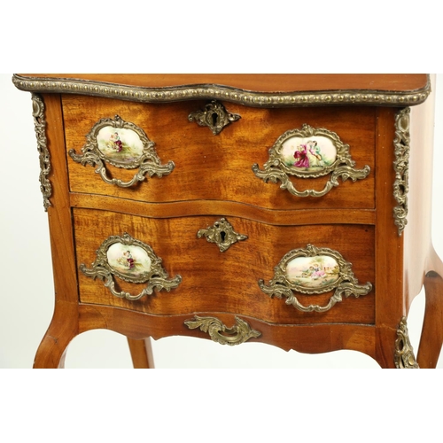 802 - A serpentine shaped French walnut and brass mounted Petite Commode, with brass mounts and porcelain ... 