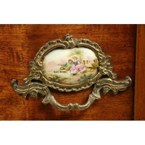 802 - A serpentine shaped French walnut and brass mounted Petite Commode, with brass mounts and porcelain ... 