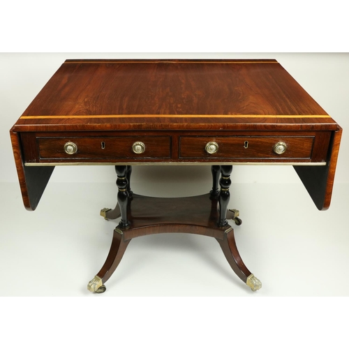 822 - A Regency period satinwood banded rosewood Sofa Table, the rectangular flaps with rounded corners, f... 