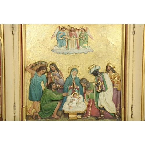 827A - A 19th Century plaster and hand painted folding Triptych, depicting the Nativity, highlighted in gil... 