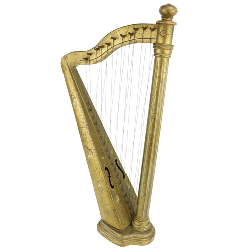 846 - A 19th Century travelling or miniature Harp, decorated in gilt and floral design on shaped stepped b... 
