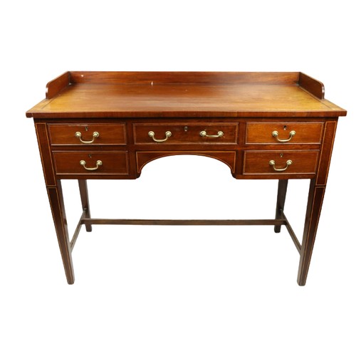 631 - An Edwardian mahogany and kingwood banded Dressing Table, with three quarter gallery above a kneehol... 