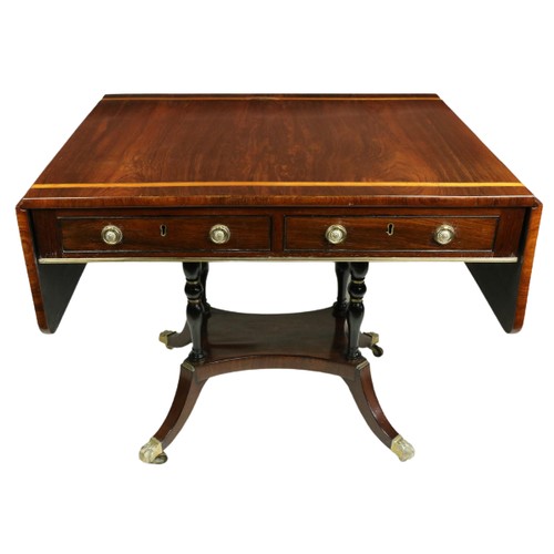 822 - A Regency period satinwood banded rosewood Sofa Table, the rectangular flaps with rounded corners, f... 