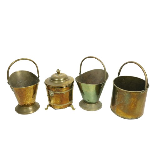 831 - A pair of brass helmet shaped swing handle Fuel Buckets, together with another brass Fuel Bucket of ... 