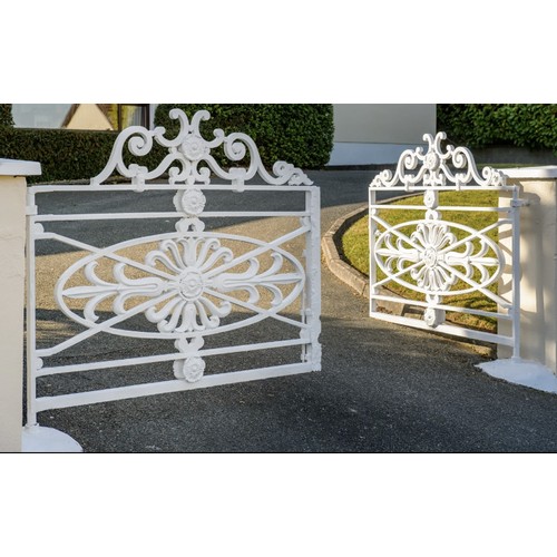 1009 - A  pair of important early 19th Century heavy Gates, each with S scrolled designs and floral motif c... 