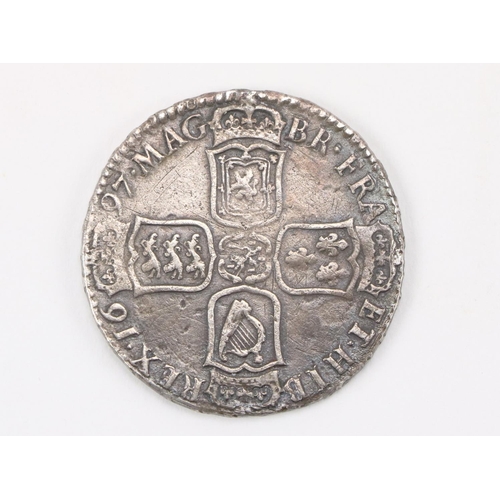 1111 - Coin:  A silver 1697 William III Coin, the obverse with side profile, the outer section inscribed 'G... 