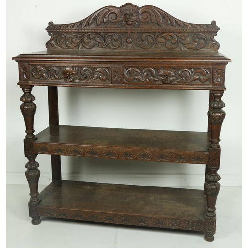 20 - A 19th Century Cromwellian style carved oak Buffet, the shaped back with central carved grotesque ma... 