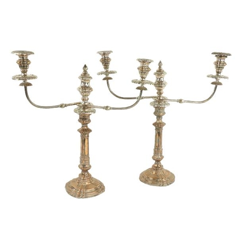 22 - A fine early pair of Sheffield silver plated two branch Candelabra, each with scrolling arms and urn... 