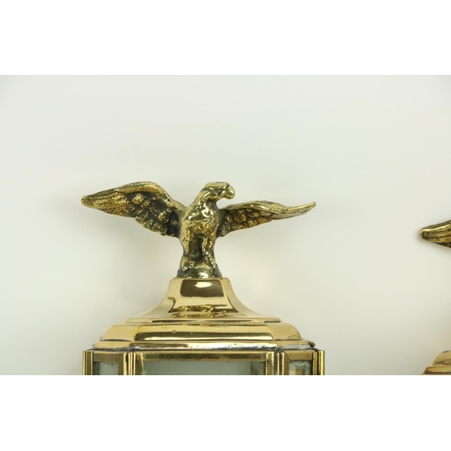 28 - A good pair of brass Wall Lights, in the form of carriage lamps, each of octagonal form with eagle f... 