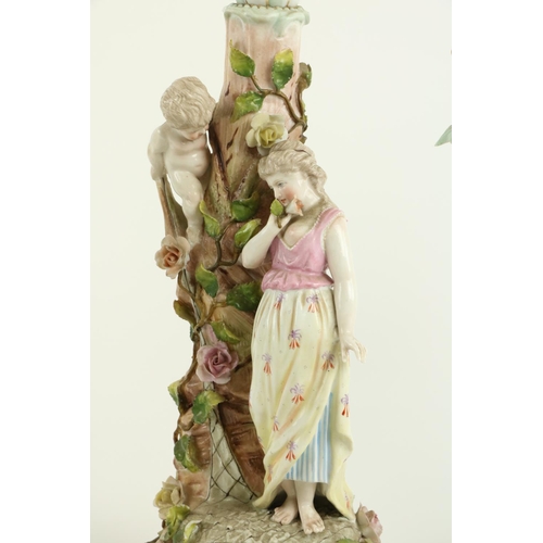 42 - An attractive pair of Sitzendorf porcelain Candelabra, each with three flower encrusted arms and a c... 