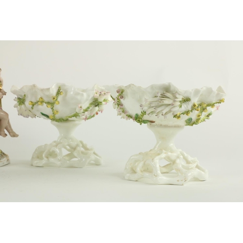 45 - A Sitzendorf porcelain Centerpiece, the pierced flower encrusted basket with floral panels on a flow... 
