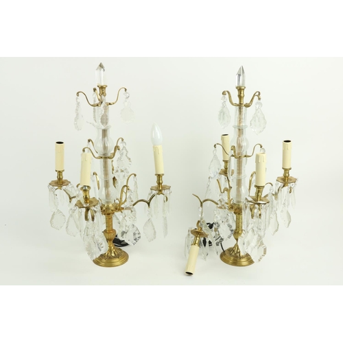 51 - A pair of brass and glass four branch Table Lamps, with lustre drops, 24'' (61cms), (an arm as is). ... 