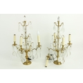 A pair of brass and glass four branch Table Lamps, with lustre drops, 24'' (61cms), (an arm as is). ... 